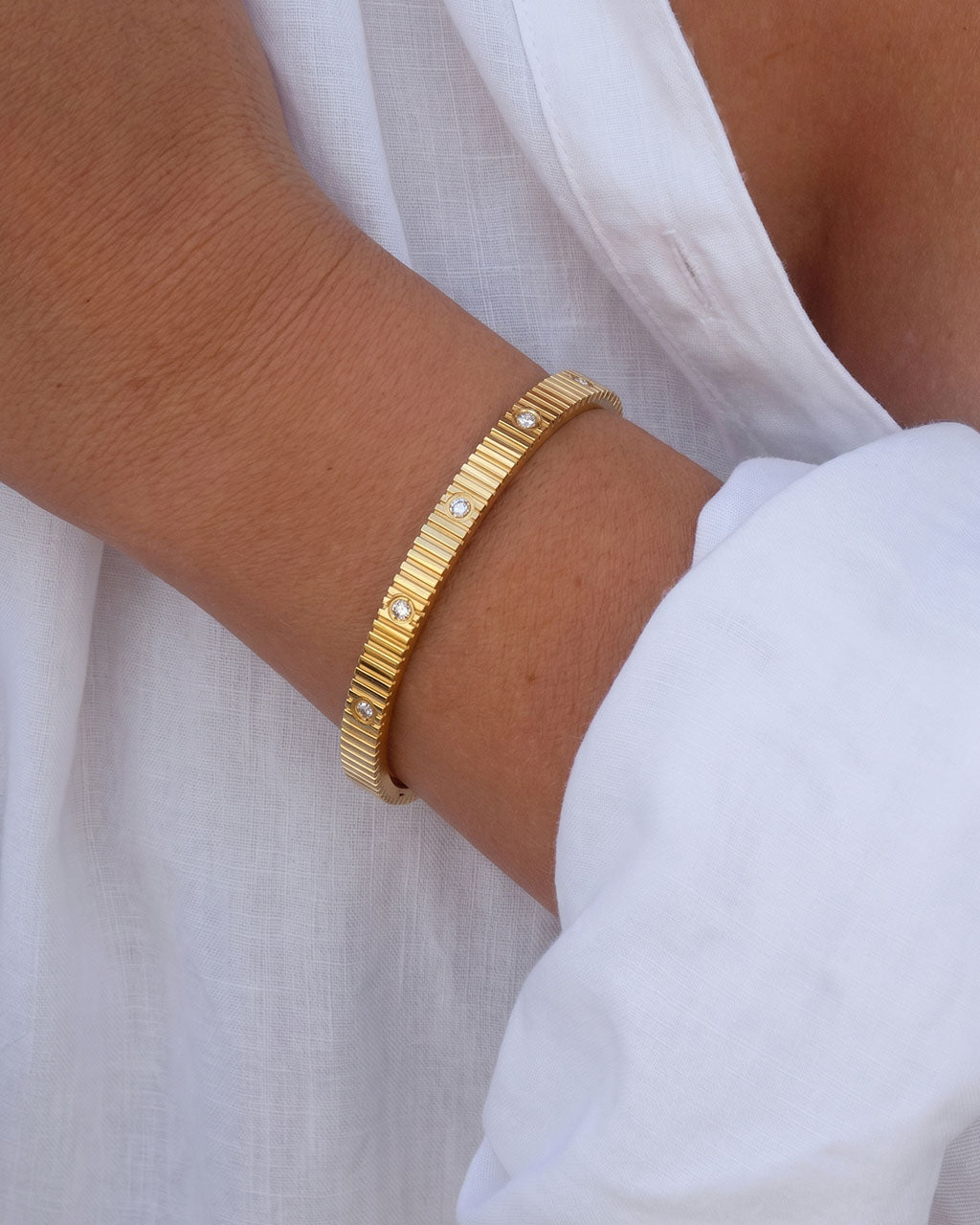 Ridged Simulated Diamond Station Waterproof Gold Bangle